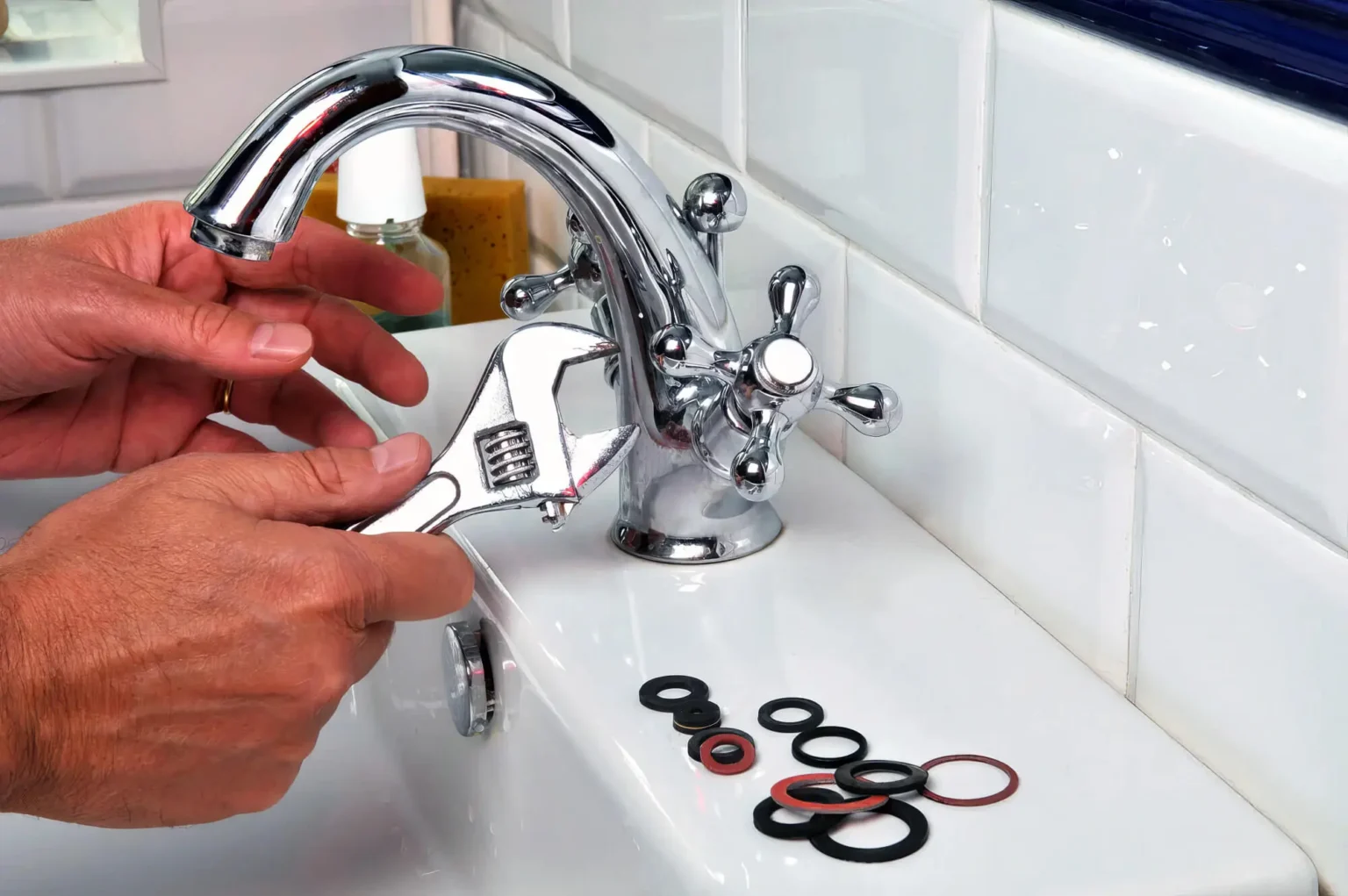 Plumber maintaining a bathroom faucet in Union City