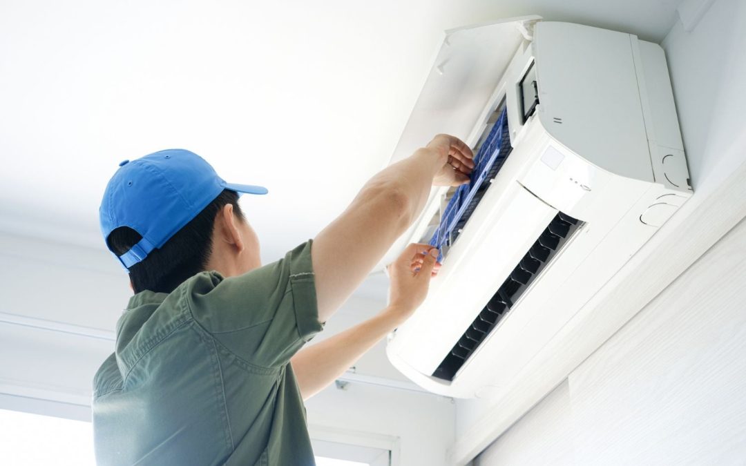 HVAC technician servicing a ductless mini split in Union City
