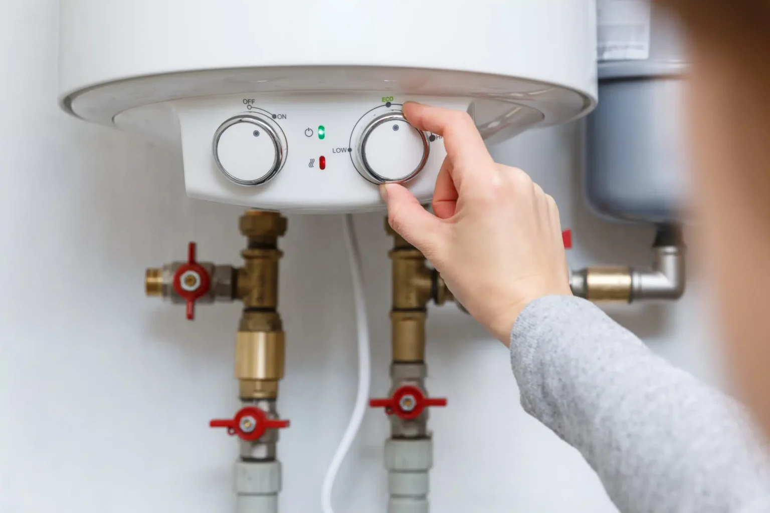 Technician adjusting a water heater in Union City